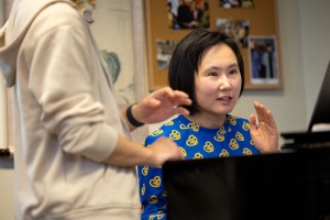 Wang Lu teaches at a piano