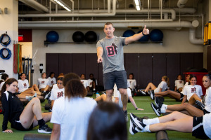 Athletic trainer Mike Pimentel leads a training with the women's soccer team. 