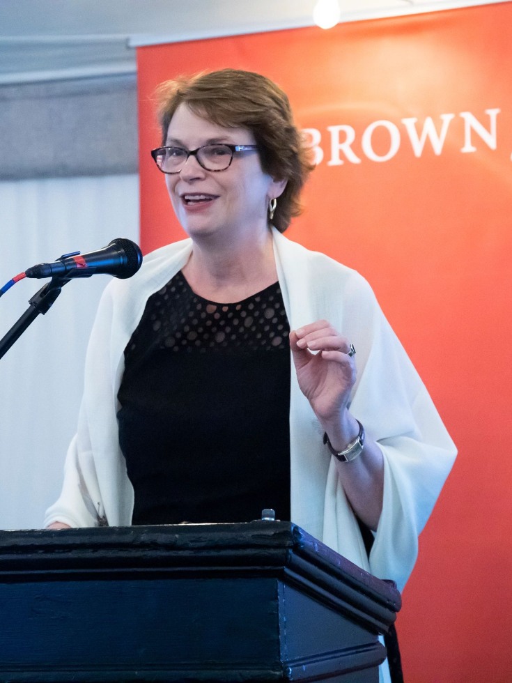 President Christina Paxson speaks at a podium