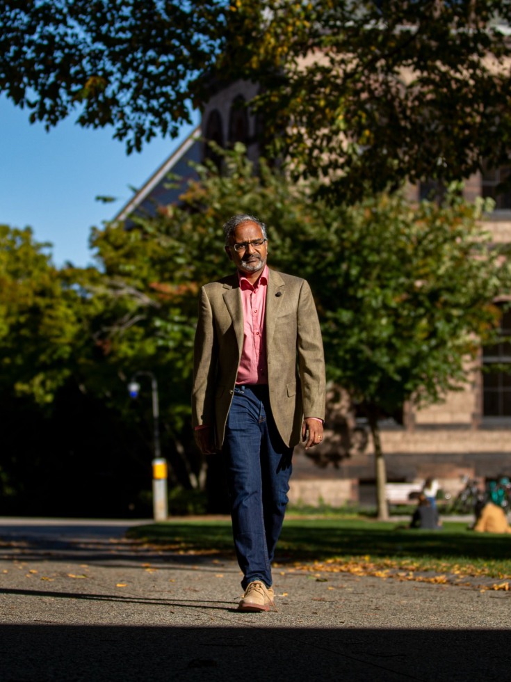 Suresh Venkatasubramanian walks on campus