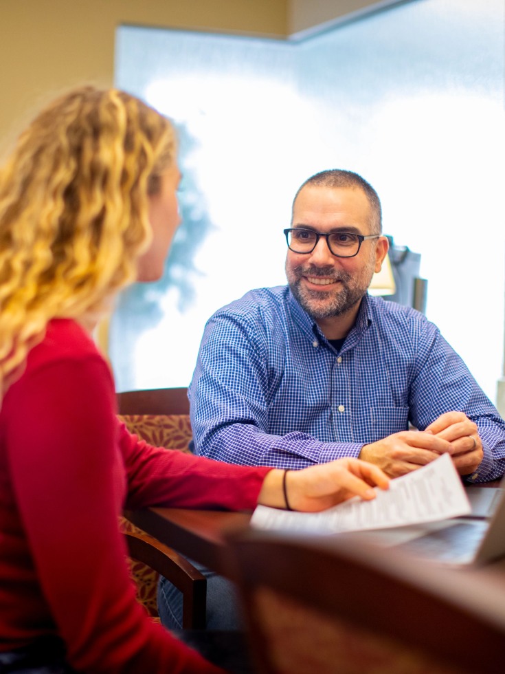 Matt Donato speaks with a student