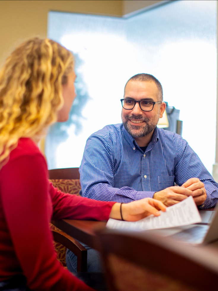 Matt Donato speaks with a student