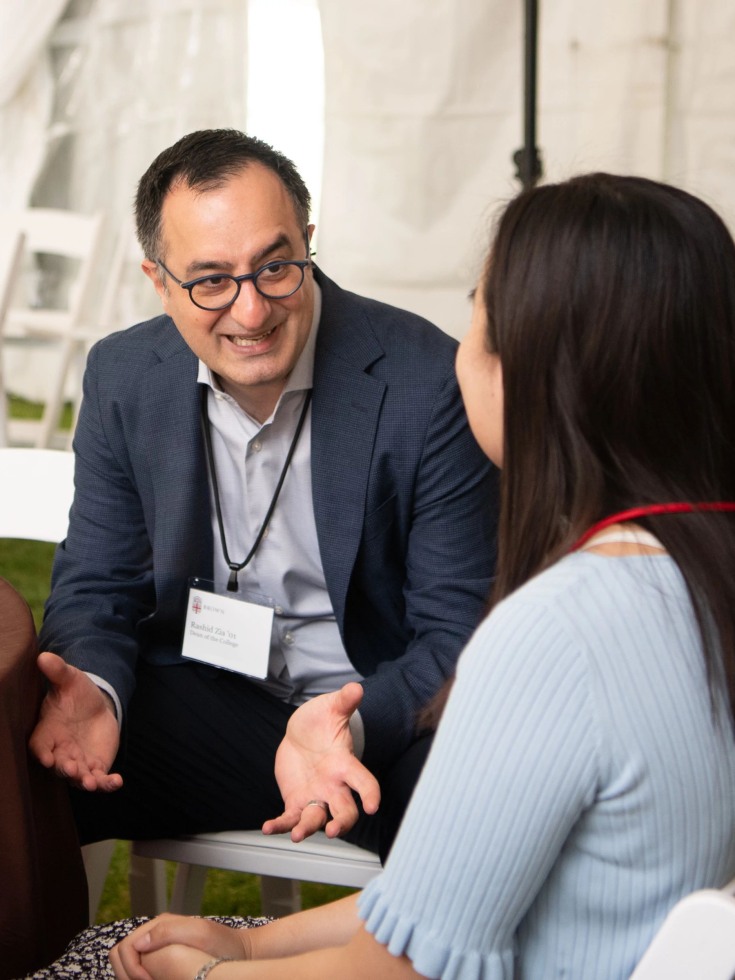 Rashid Zia talks to a student