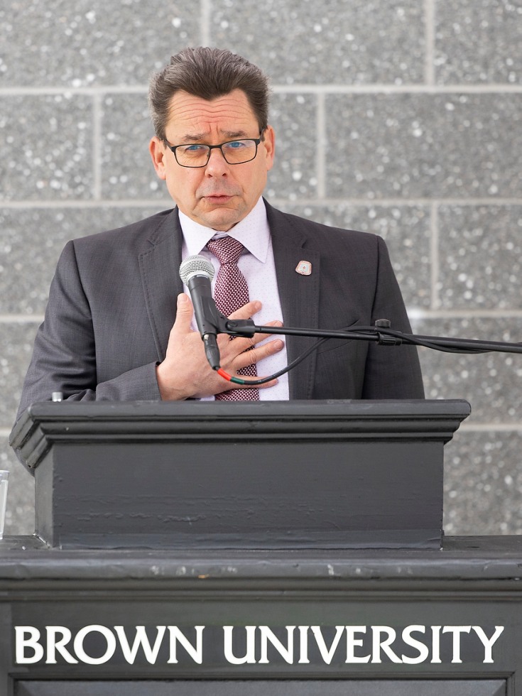 andrew cortes speaks at podium