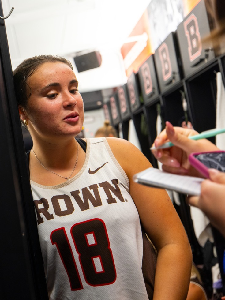 Lizzie Loftus speaks to reporter in locker room 