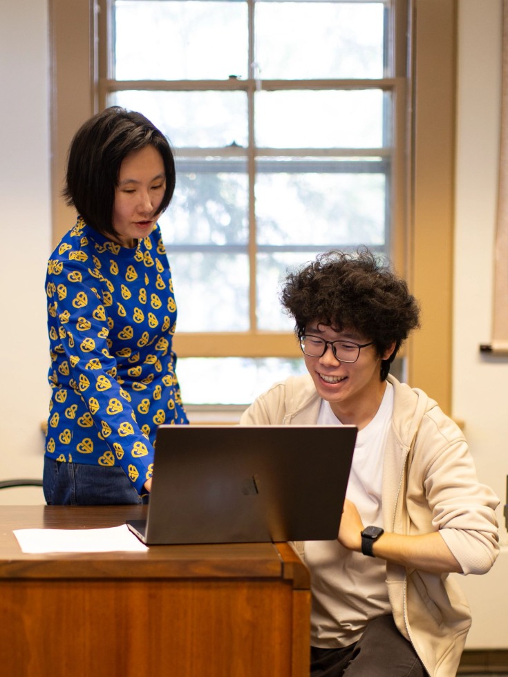Wang Lu works with student Henry Wang