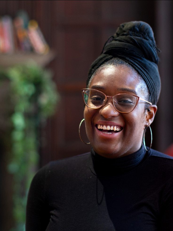 Teniesea Russell smiles in Rochambeau House