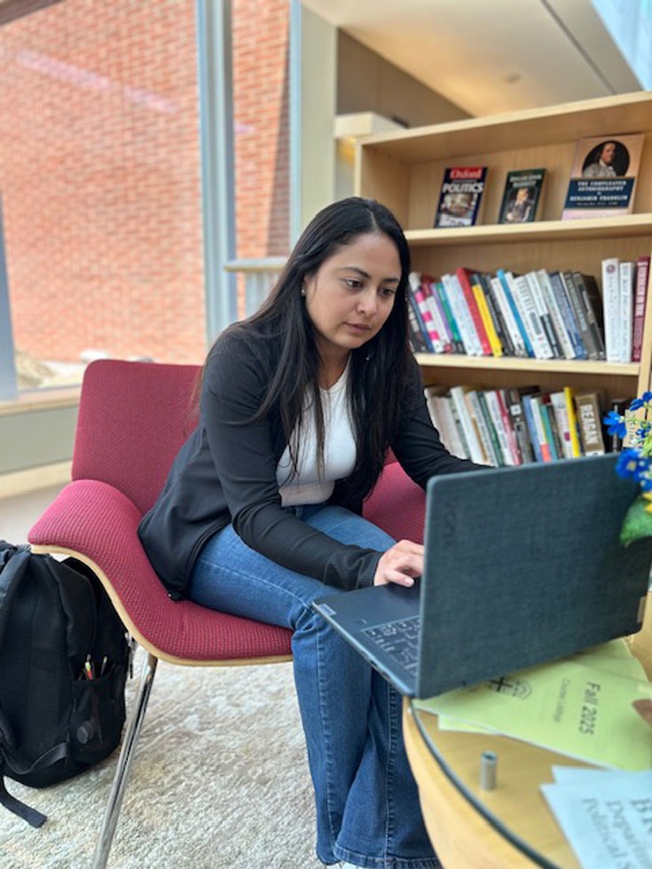 Clarisa Torres works on computer 
