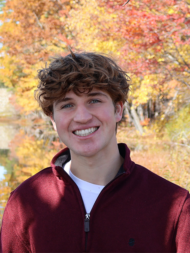 a person standing in front of trees