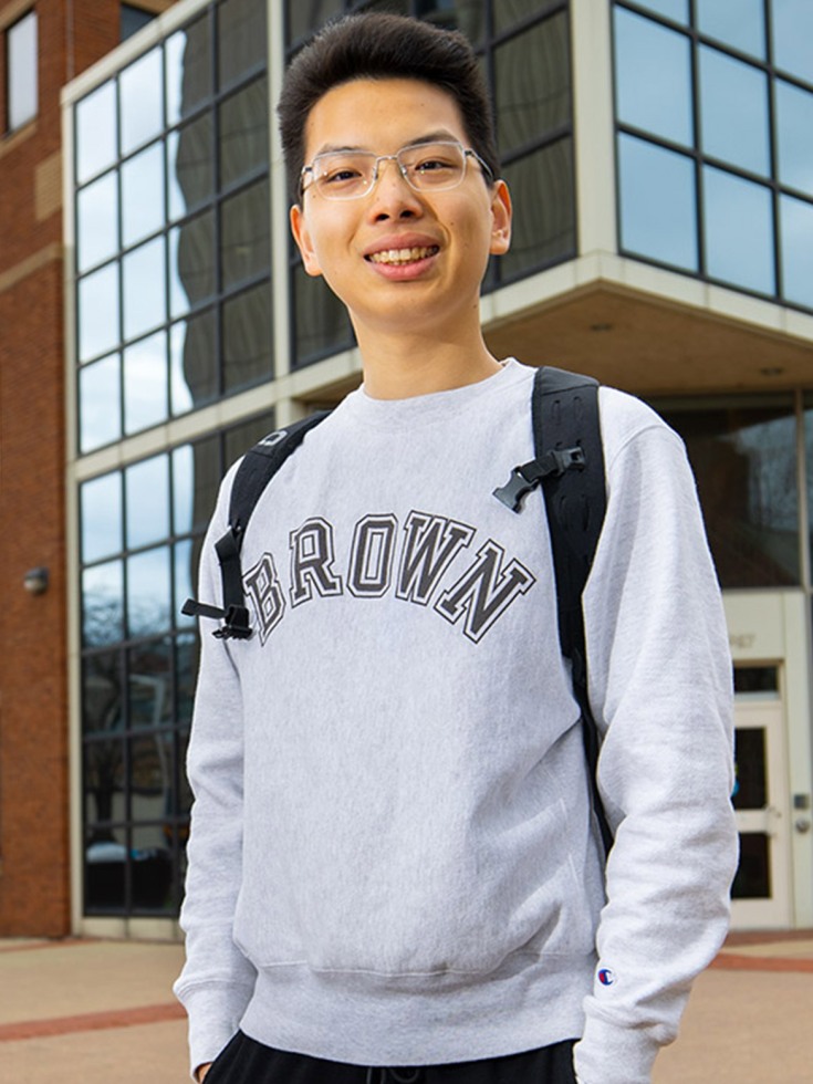 Kailiang Fu standing on steps