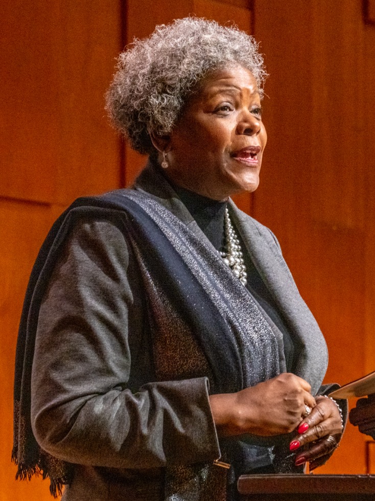 Sylvia Carey-Butler speaks at a podium