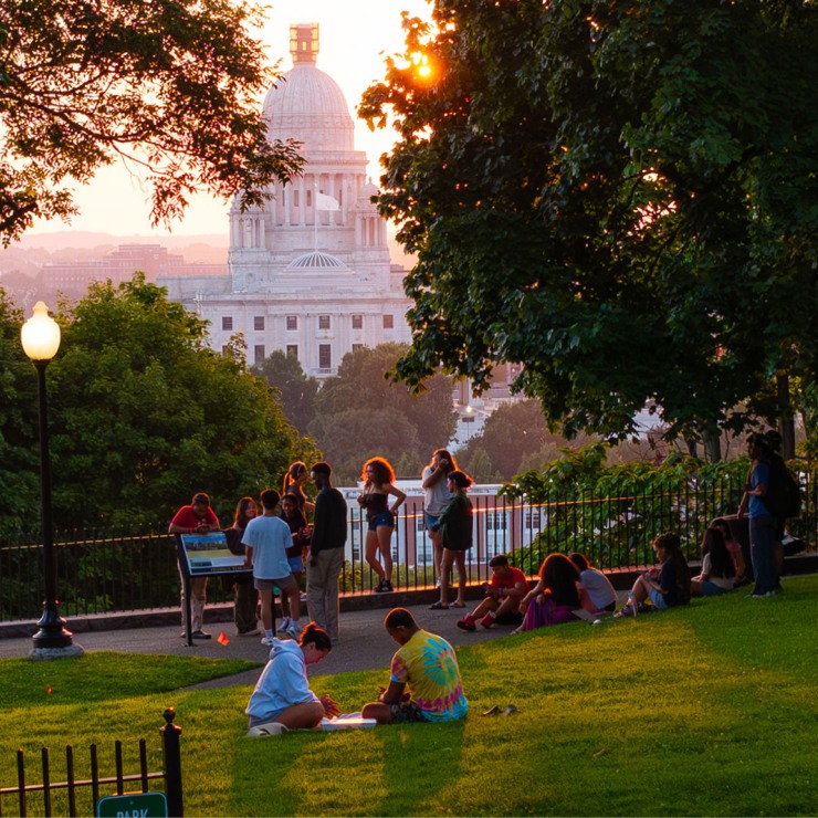 Student in a park overlooking the state capitol.