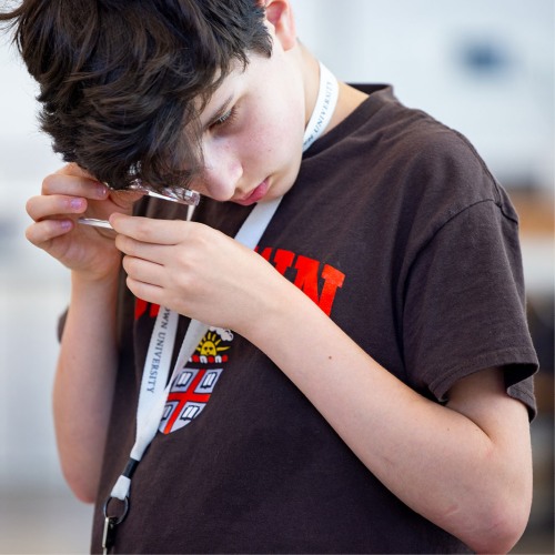 Student using a loupe.
