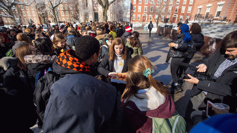 Organizers hand out orange stickers