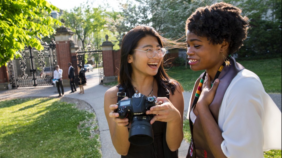 Students taking photos on campus