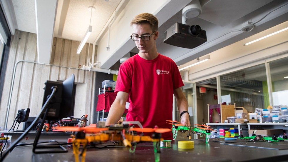 UTRA participant in lab with drone