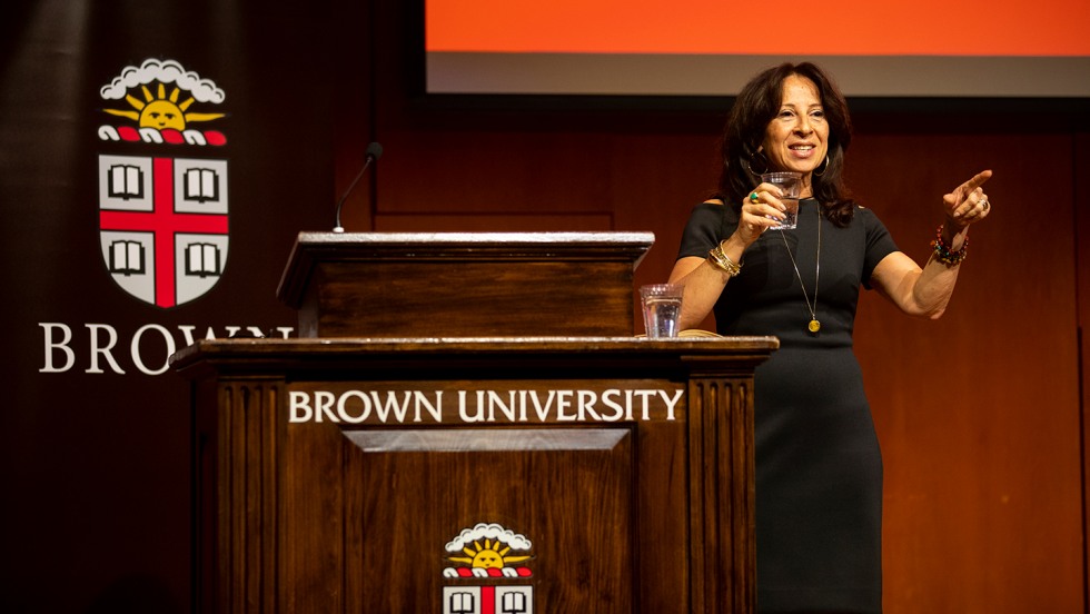 Maria Hinojosa speaking at a podium