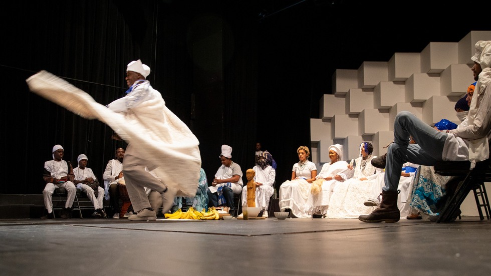 Man dancing, waving his cloak 