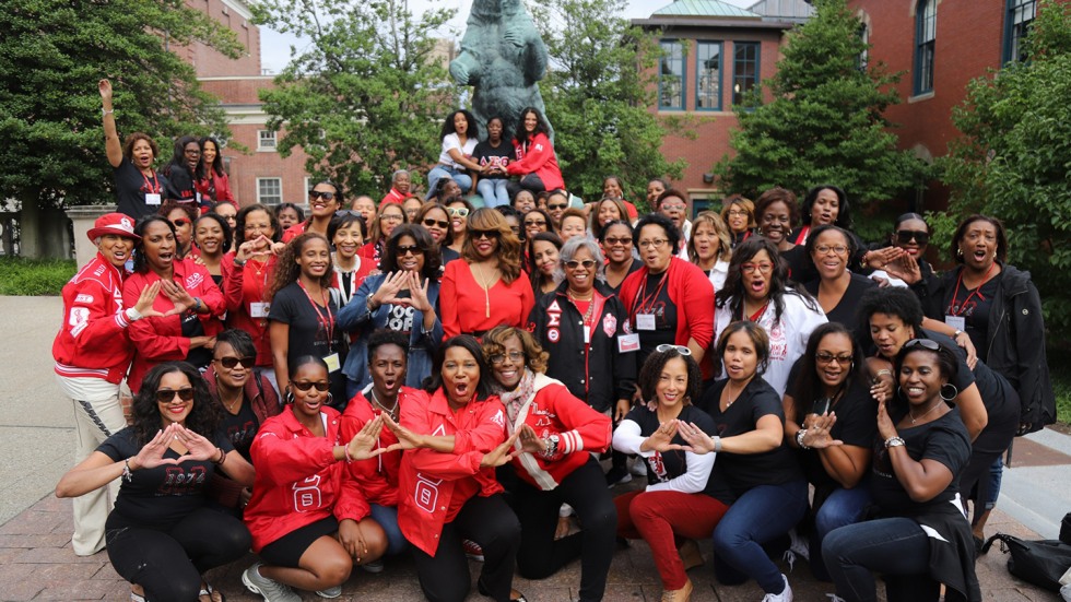 Sorority members wearing red in a group photo