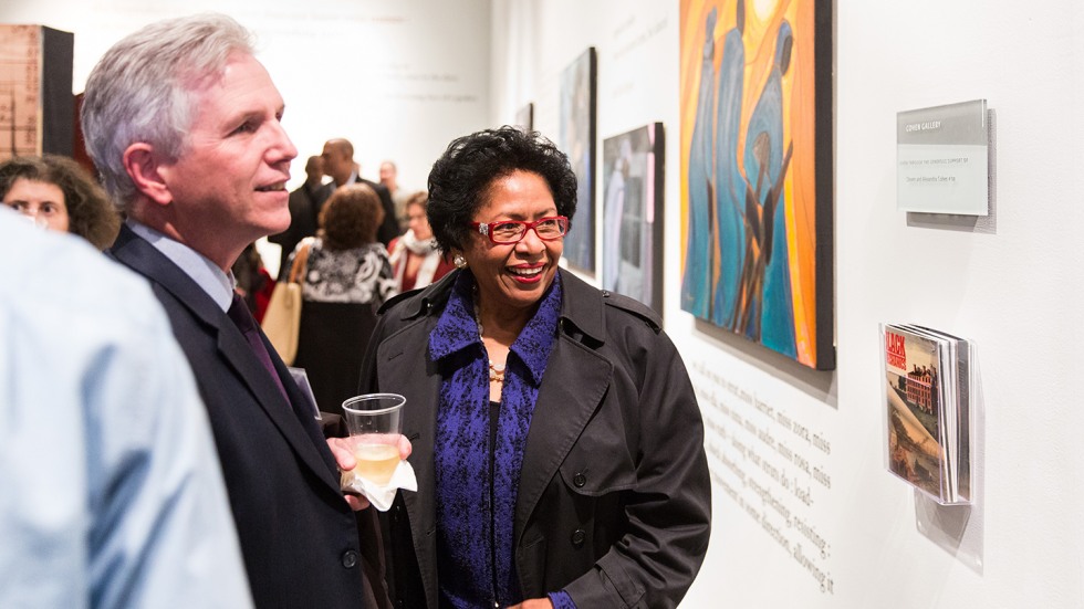 Ruth Simmons admiring a piece in the gallery