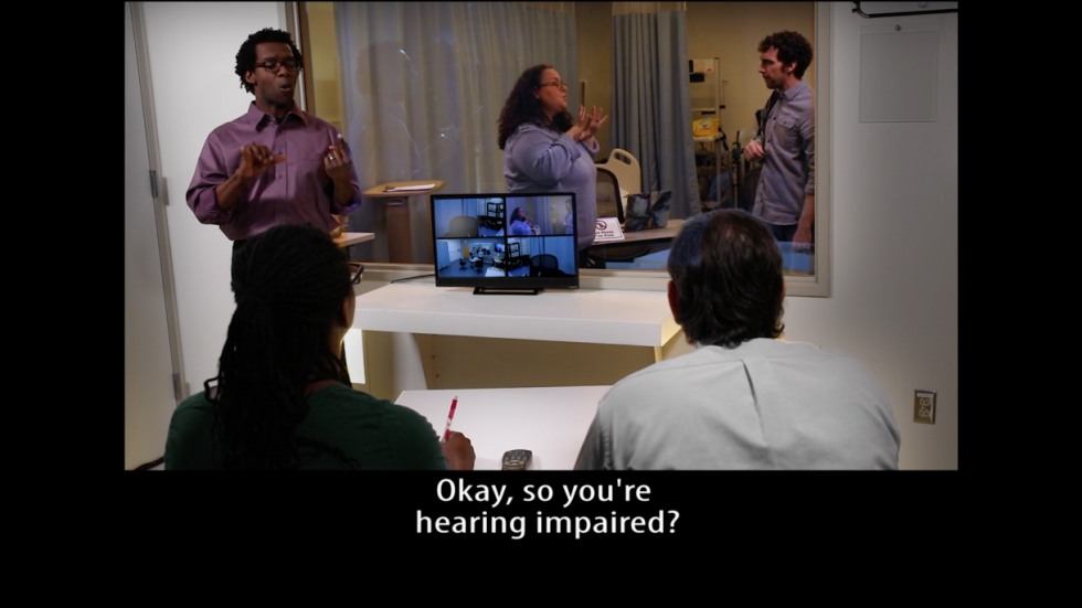 Video still with caption: Okay, so you're hearing impaired?