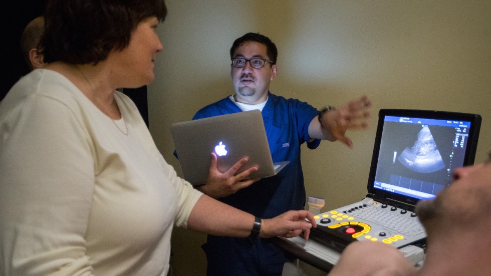 Brian Kwan and Dr. Luba Dumenco looking at ultrasound results on computer