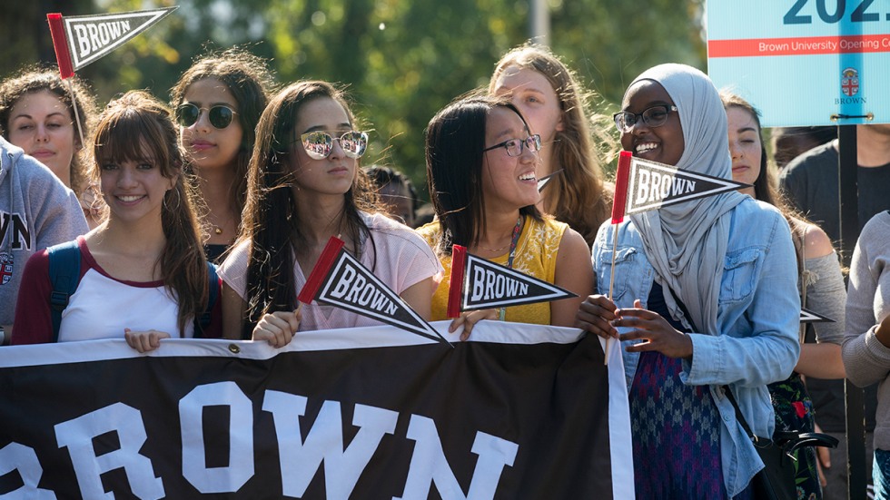 First-year Brown students carrying the Class of 2021 banner