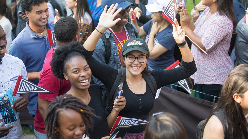 Students waving Brown flags