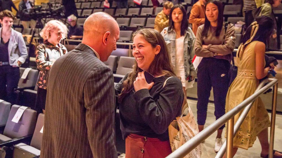 Anthony Romero with a Brown student