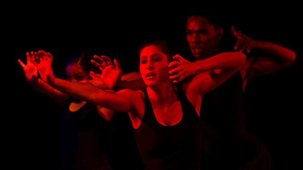 Dancers in red light