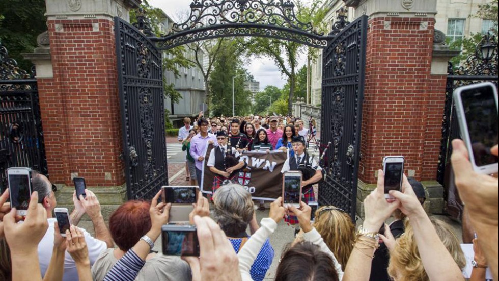 Students marching through the gates
