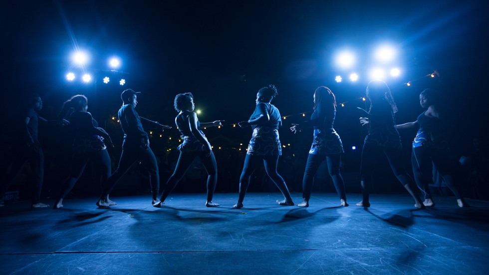 Dancers on stage in blue light