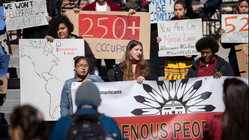 Students holding signs.