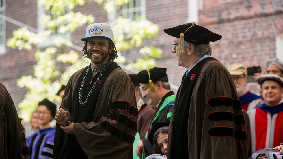 Daveed Diggs laughing behind podium