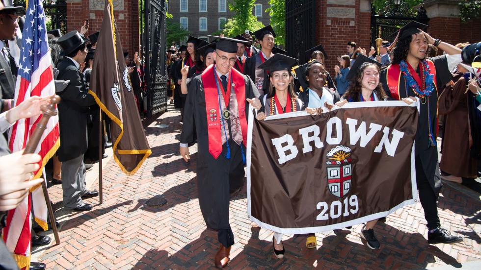 Image of the Class of 2019 walking through the Van Wickle Gates.