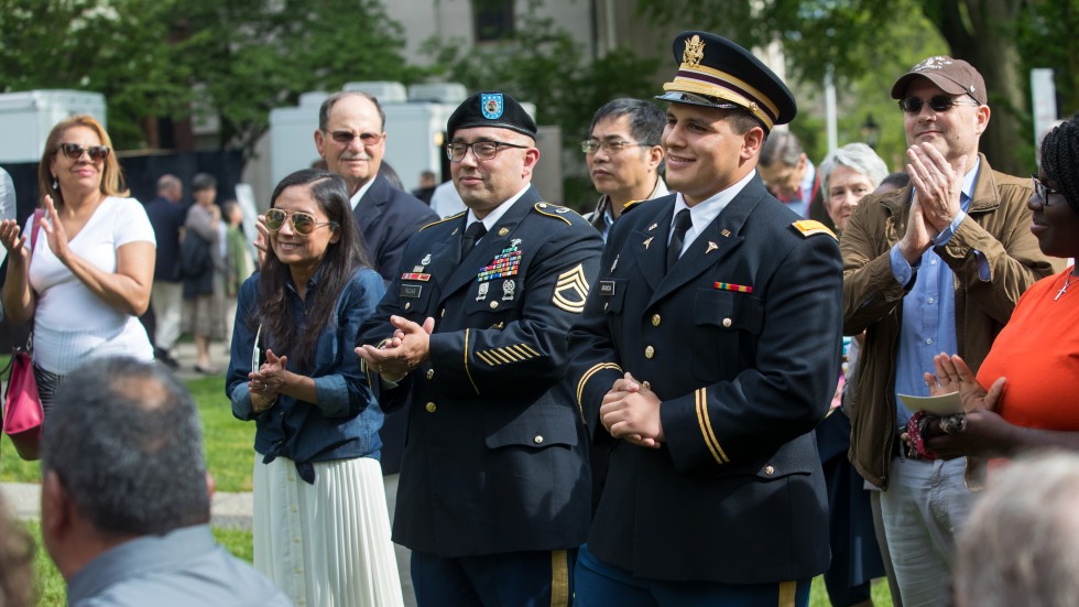 Marcos Aranda in uniform being cheered on by onlookers