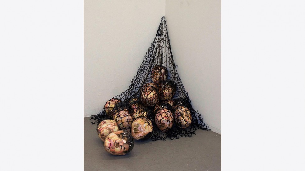 Art piece, heads in a net