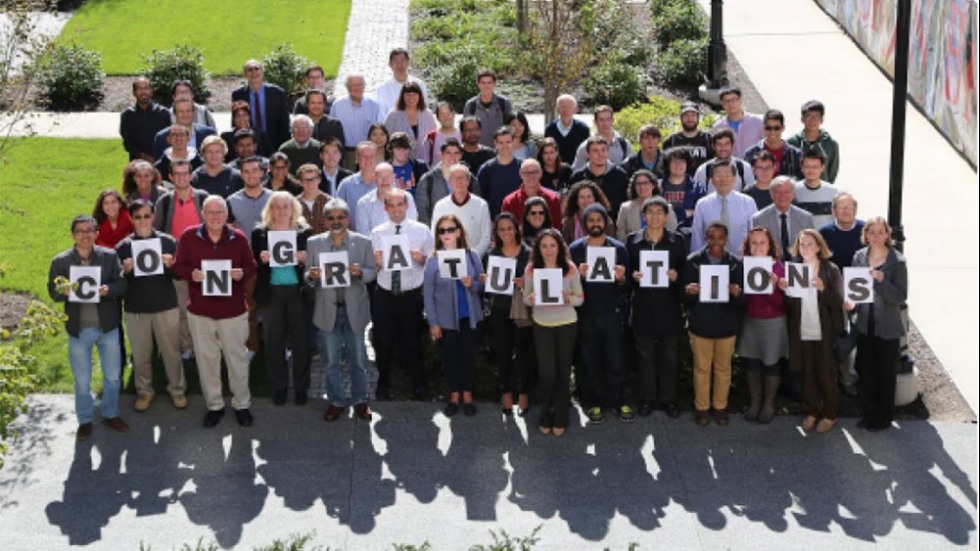 Group holding letters that spell Congratulations