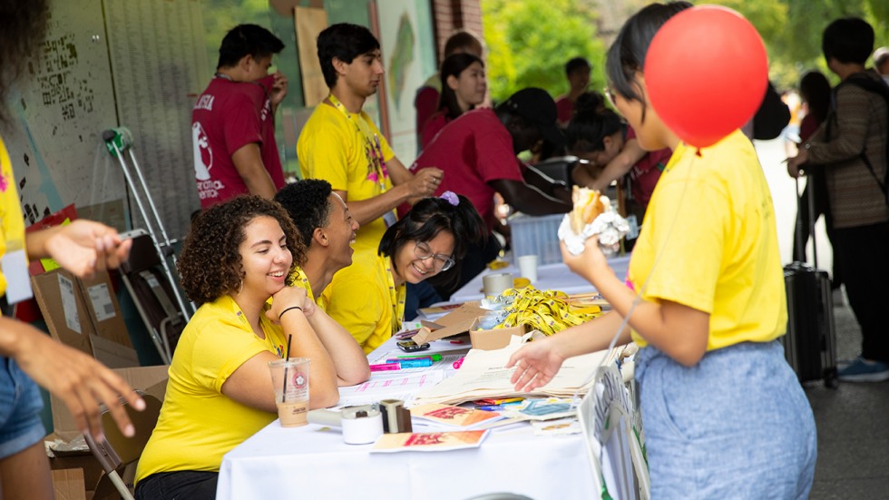 Students laughing at table 