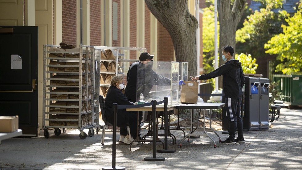 Brown University student picks up meal.