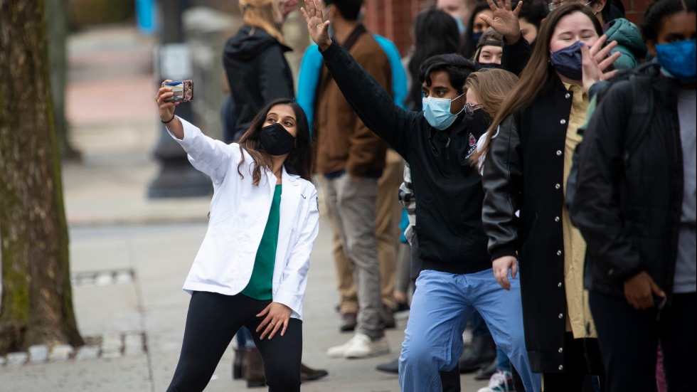 Students taking selfies along Prospect Street