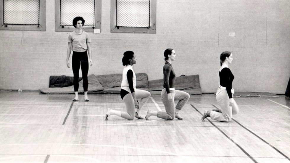 dancers rehearsing in a gym