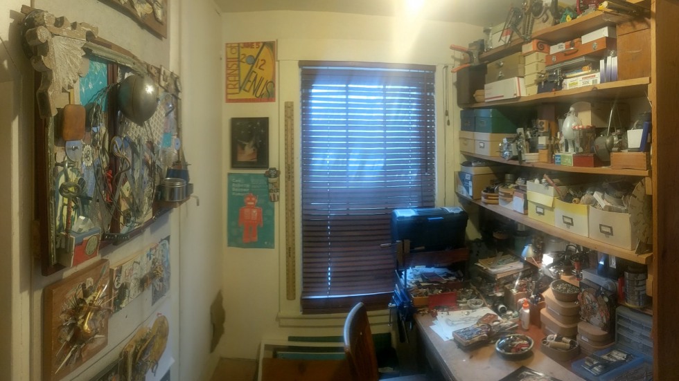 Small room lined with shelves of art supplies