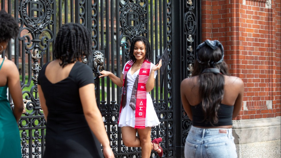 Class of 2021 student poses at Van Wickle Gates