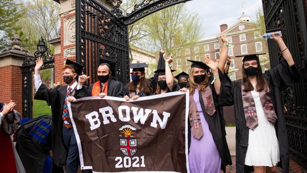 Students marching through the Van Wickle Gates