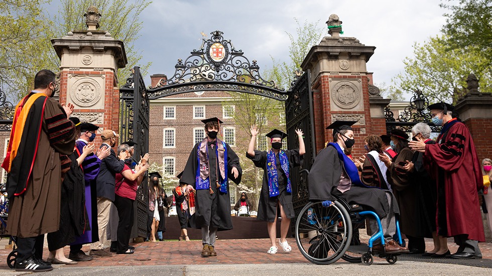 Graduates exit through the Van Wickles Gates