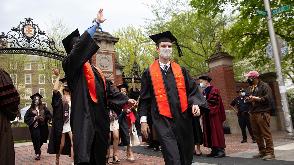 Faculty applauding graduates