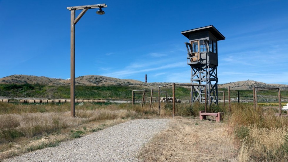 abandoned guard tower in a deserted hilly landscape