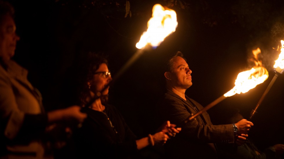 Brown torch-bearers during WaterFire