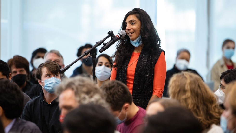 Prerna Singh standing at a microphone